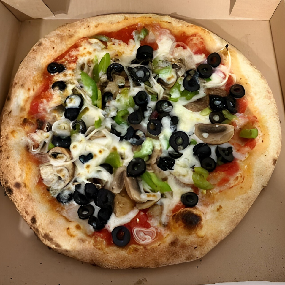 CraveN Pizza's whole pizza with black olives, green peppers, and mushrooms in a box.