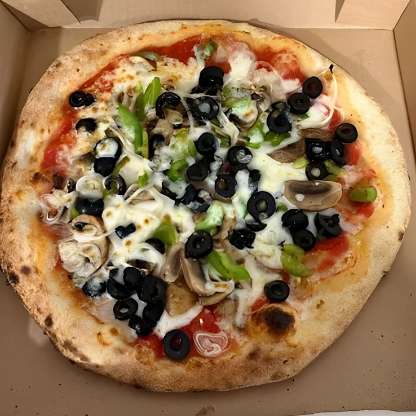 CraveN Pizza's whole pizza with black olives, green peppers, and mushrooms in a box.